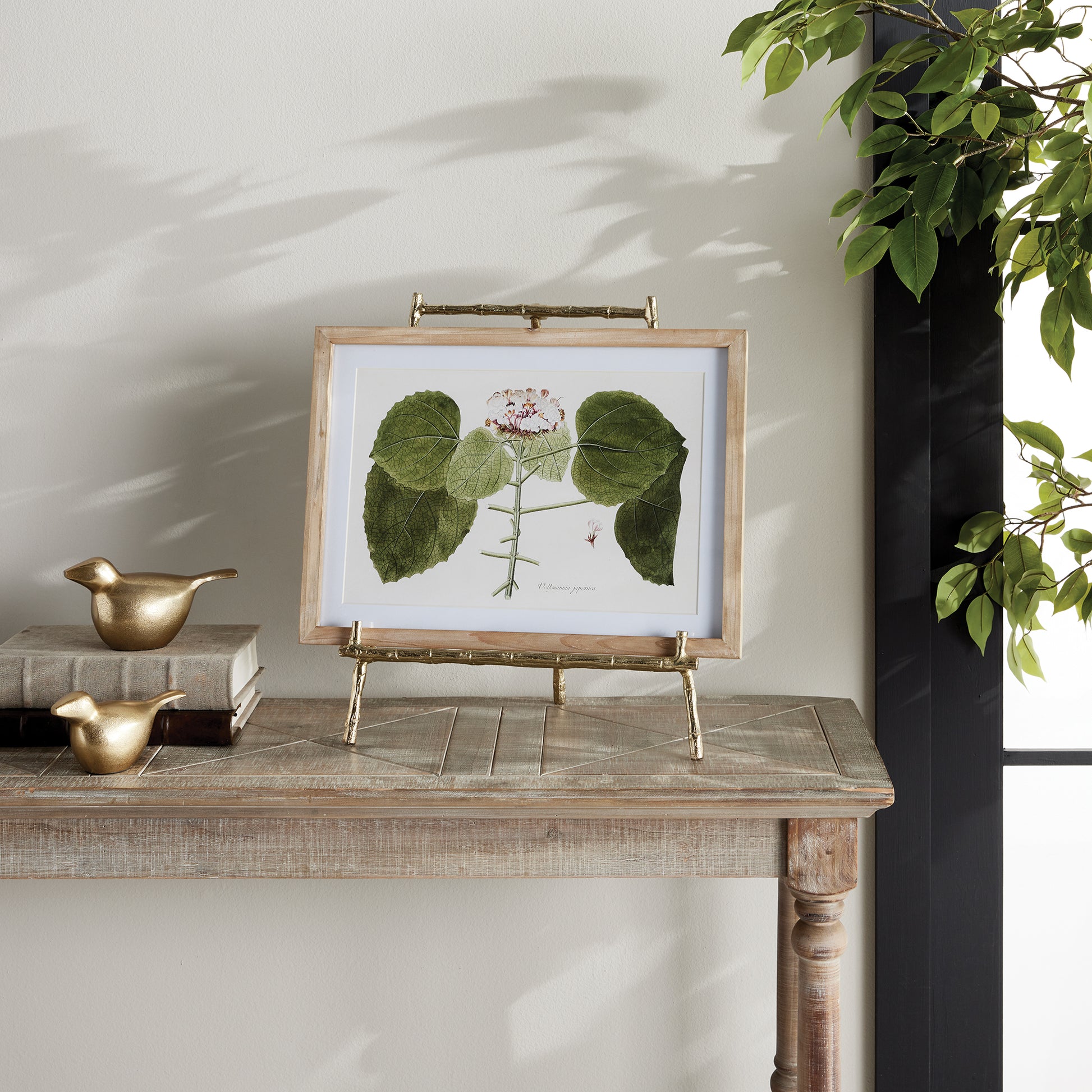 Expertly designed to securely hold heavy objects such as platters, cookbooks, and small pieces of art, the Gold Easel Large is the perfect choice for versatile display needs. Featuring a classic design with elegant gold bamboo-like details, this easel adds a touch of timeless sophistication to any setting. Its sturdy structure ensures the protection of your items while adding a professional and educational element to your display.