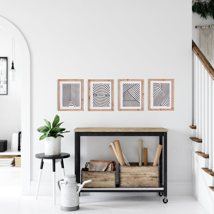 These Achromatic Linear Petite Prints showcase a traditional wood block printing technique, resulting in a visually compelling monochromatic design. The varied ink saturation adds depth and texture to each print, beautifully complemented by the elegant neutral wood frames. A must-have set for any refined and sophisticated office or study space.