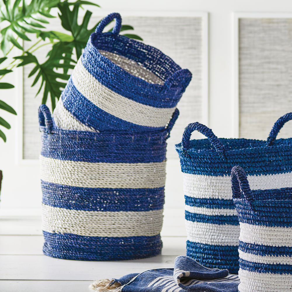 These versatile Blue &amp; White Utility Baskets, set of 2, in the signature Barclay Butera blue and white stripes, are an essential addition to any home. Whether used in the laundry room or to neatly store towels and linens, these expertly designed and crafted baskets add a sophisticated touch to any space. Their stylish striped design serves as a chic accent to complement any decor, making them a must-have for organizational needs.