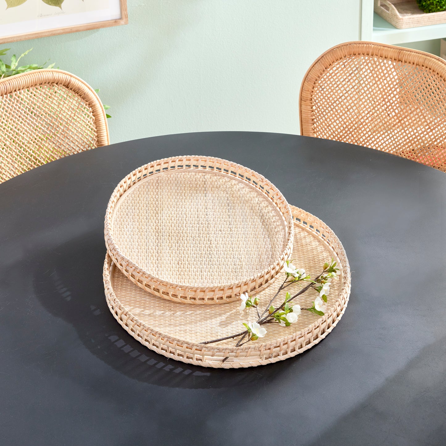 Crafted from woven rattan and coated with a fresh whitewash finish, these coastal-inspired trays add a touch of charm to any space. Use them on your coffee table or ottoman as a stylish base for creating beautiful vignettes. Enhance your home decor with Barri Coastal Decorative Trays Set of 2.