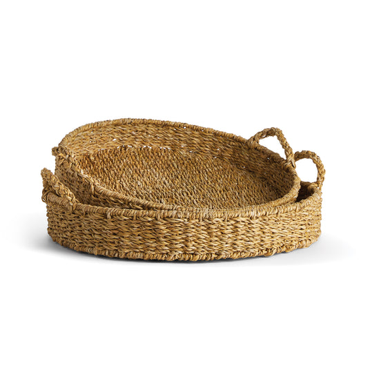 Our Seagrass is double-walled baskets that are supple, not stiff. They're beautiful in texture - just as nature intended. These round trays with handles are no exception. Casually versatile in every way.