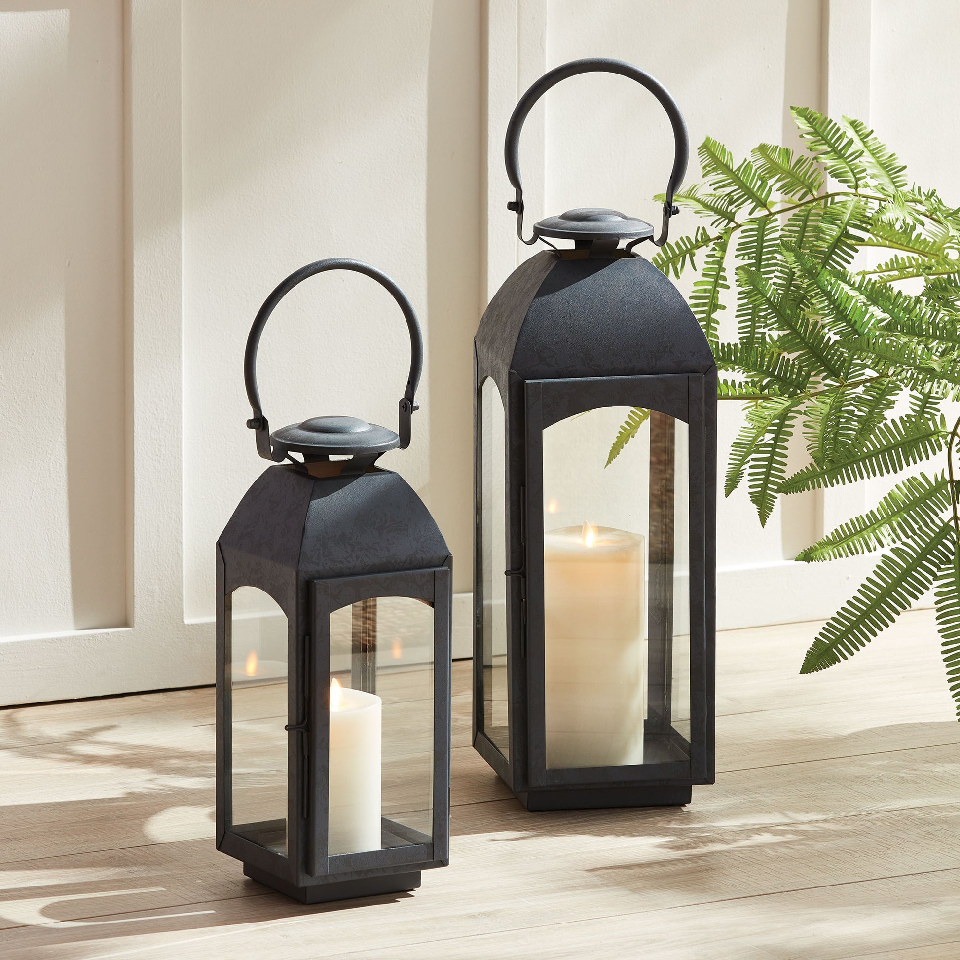 Crafted with a chic faux zinc finish and soft grey tone, this outdoor lantern brings a touch of old European style to your outdoor space. Its vintage-inspired design is true to the authentic qualities of the lantern, perfect for creating a sophisticated ambiance. Enhance your outdoor decor with the Antoinne Outdoor Gray Lantern Small and add a charming European touch.