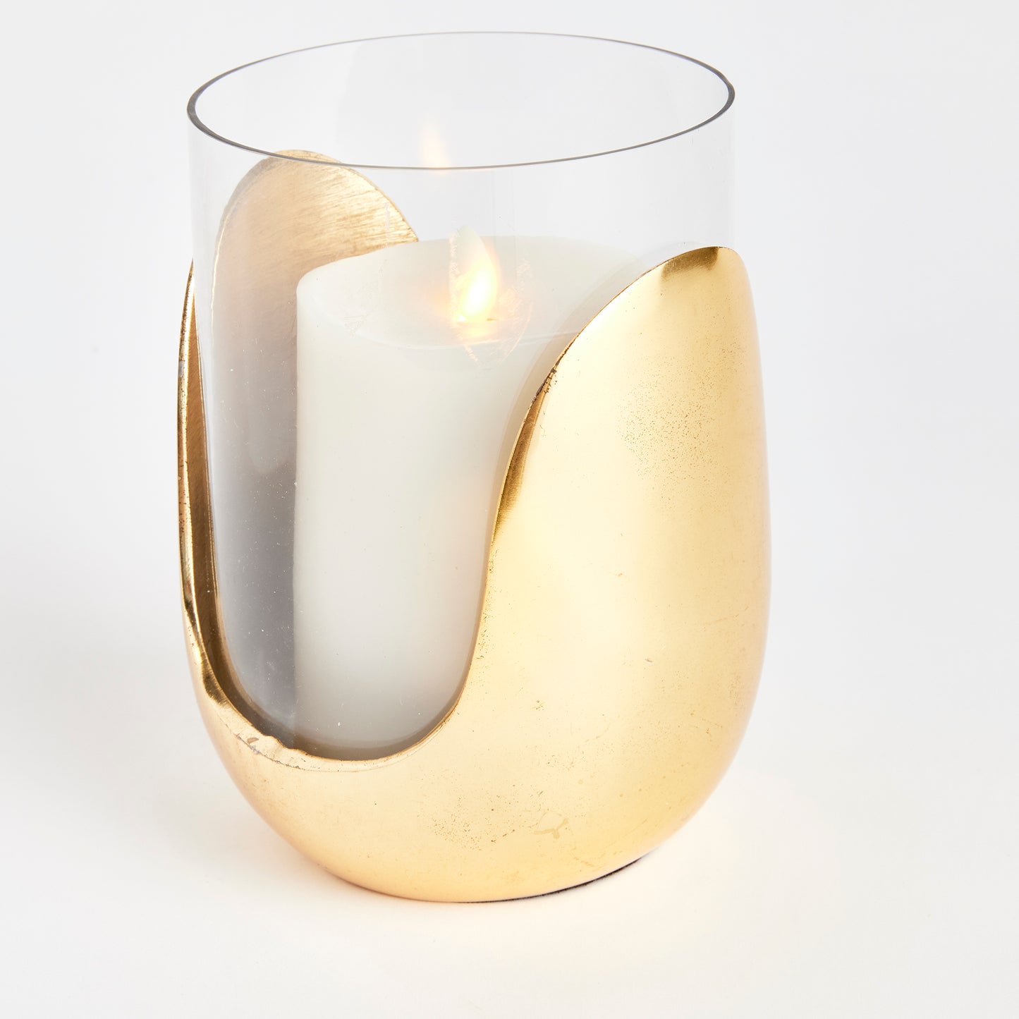 Expertly crafted with a blend of materials, the Aida Gold Hurricane Medium boasts a stunning design that combines hand blown glass and cast aluminum in a warm champagne finish. Whether placed on a side table, console, or mantel, this unique contemporary accent piece is sure to elevate any space. Its durable construction guarantees long-lasting use, making it a functional and stylish addition to any home.