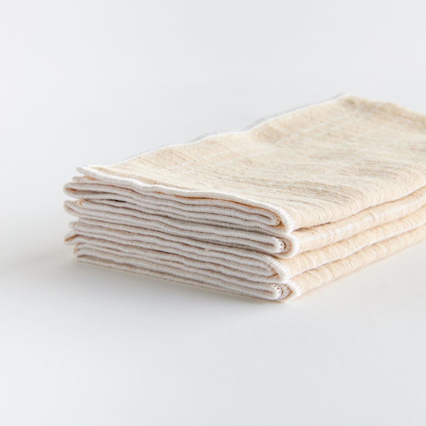 Bring a touch of softness to the table with this set of four cotton napkins. Beautiful in tone and texture, the soft taupe is made to coordinate with any tablescape. Elevate your dining experience with these high-quality cotton napkins. Their luxurious texture and neutral taupe color will elevate any tablescape, making it perfect for any occasion.