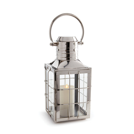 In classic maritime shapes, this outdoor lantern adds an upscale touch indoors or out. Smaller in size, it's perfect for side table or coffee table.