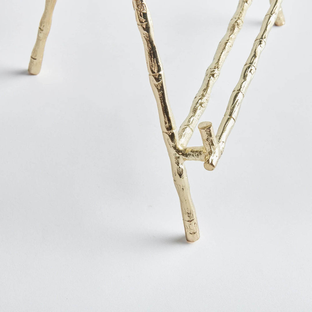 Expertly designed to securely hold heavy objects such as platters, cookbooks, and small pieces of art, the Gold Easel Large is the perfect choice for versatile display needs. Featuring a classic design with elegant gold bamboo-like details, this easel adds a touch of timeless sophistication to any setting. Its sturdy structure ensures the protection of your items while adding a professional and educational element to your display.
