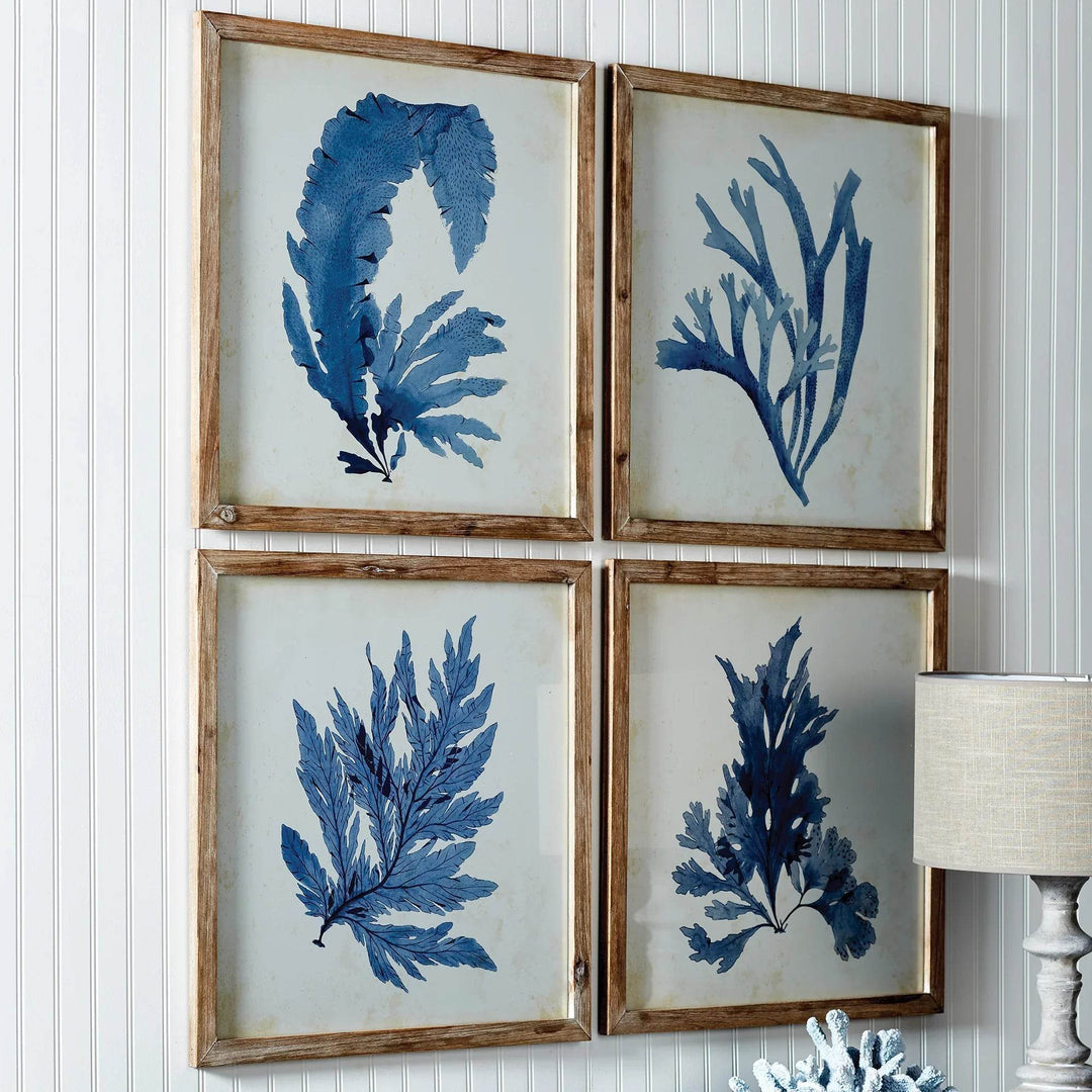These coral prints offer a unique blend of elegance and scale, perfect for a coastal, upscale aesthetic. The soft, watercolor design and whitewashed frames suit both home and office settings. Experience sophistication and coastal charm in your space with these exquisite coral prints. The delicate watercolor design and natural wood frames elevate any room, making them versatile additions to any home or office.