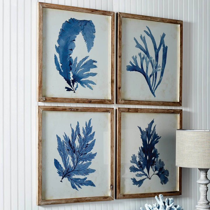 These coral prints offer a unique blend of elegance and scale, perfect for a coastal, upscale aesthetic. The soft, watercolor design and whitewashed frames suit both home and office settings. Experience sophistication and coastal charm in your space with these exquisite coral prints. The delicate watercolor design and natural wood frames elevate any room, making them versatile additions to any home or office.