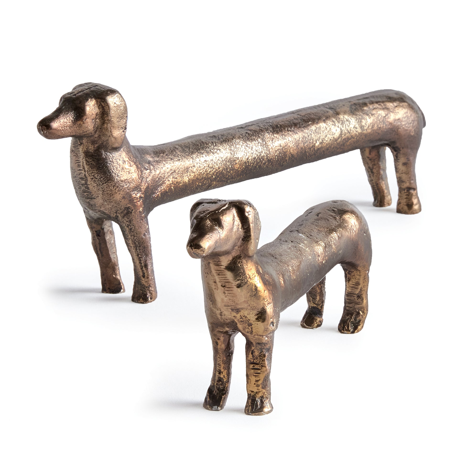 Made of a heavy cast aluminum, this set of regal dachshund sculptures are worthy of a prime bookshelf spot. With abstract, exaggerated features, a darling addition to side table or ottoman.