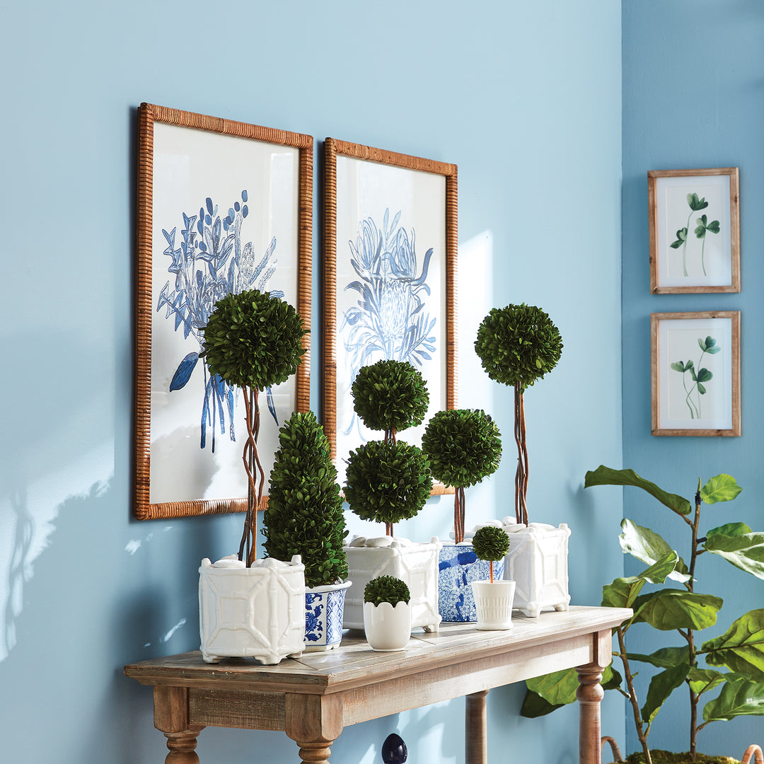 These large-scale monochromatic floral prints are perfect for any room, whether it is your bedroom, study, or guest bath. Plus, the charming touch of the intricate rattan frames makes them truly impressive. Elevate your decor with this whimsical set of two bouquets, finished off with rattan-wrapped frames.