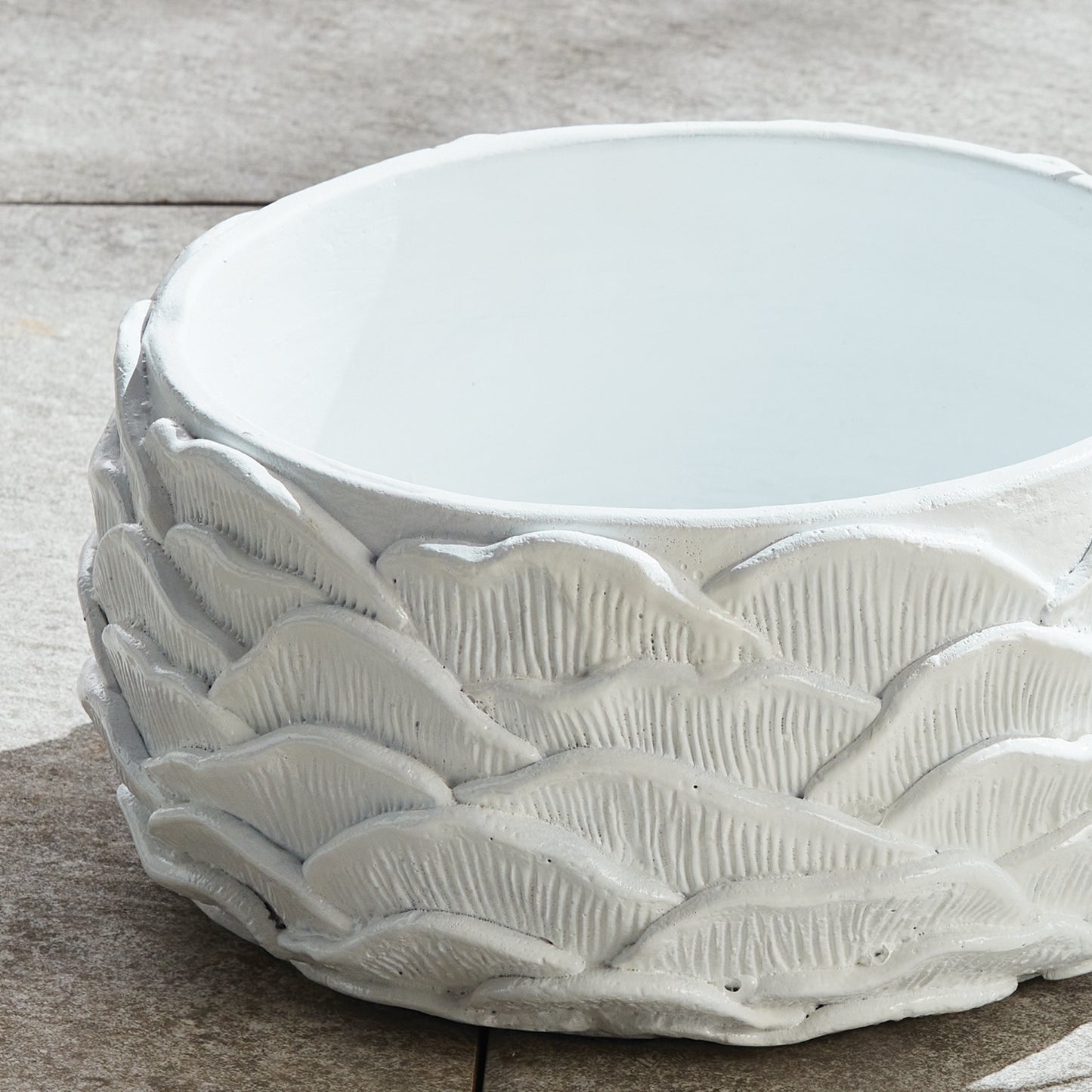 The Ashika Concrete Planter Pots, Set of 2, features an expertly crafted, layered design that adds an artisan touch to any space. With a bright white glaze and meticulous hand finishing, these pots offer exceptional value and a professional appearance. Whether displaying lush greens or a beautiful orchid, these pots are sure to add a nature-inspired element to your home.