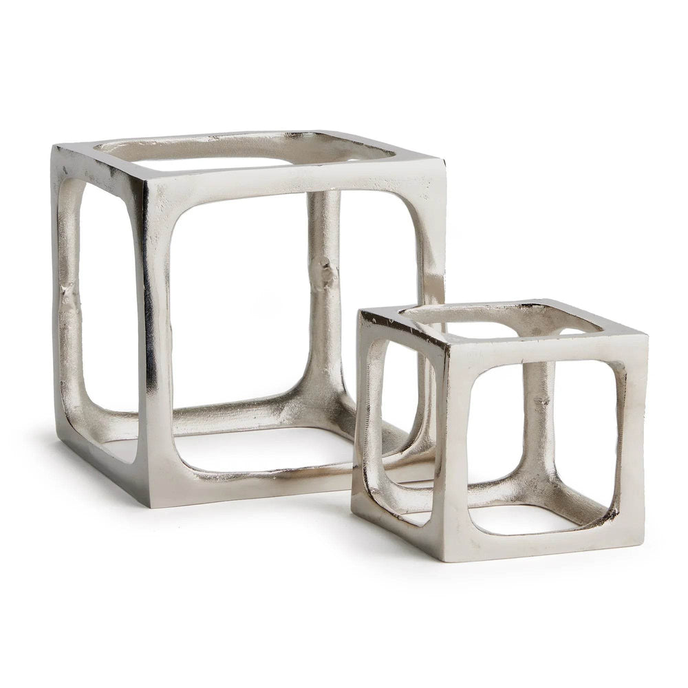 Two metallic cube-shaped side sculptures on a white background