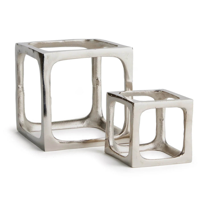 Two metallic cube-shaped side sculptures on a white background