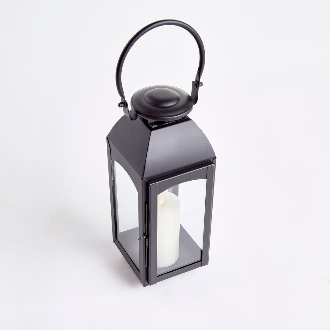 Experience the expert craftsmanship of the Antoinne Outdoor Black Lantern Small, exuding timeless elegance with a nod to classic European design. This chic lantern boasts a sophisticated aesthetic, complemented by a bold black tone that adds a touch of drama to any outdoor space. Crafted with high-quality faux zinc material, this lantern is built to last and elevate the style of your outdoor area with its professional and expertly crafted design.