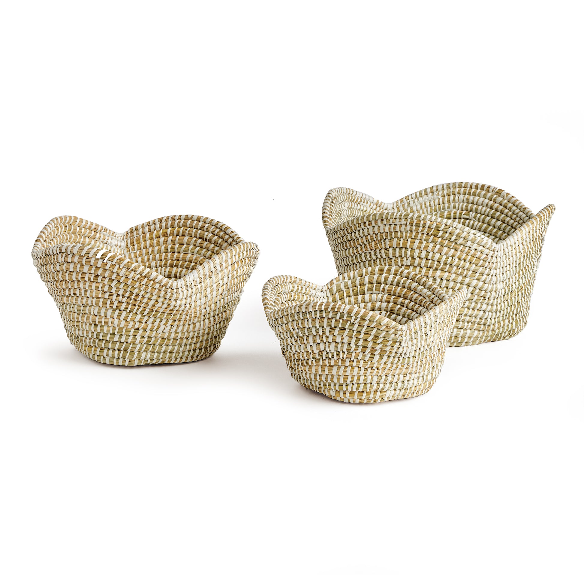 These well-scaled all natural baskets are hand-woven by skilled artisans using sustainable materials. With sculpted petal-like rims, they are just perfect for creating that spa-inspired look for home or office.