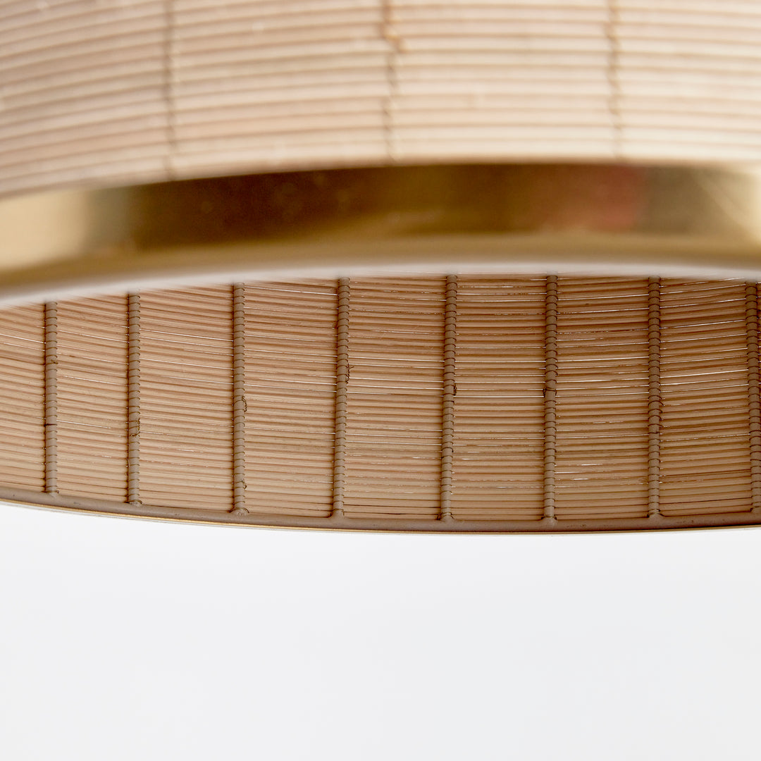 Crafted from natural cane rattan, the Maye Dome Pendant Light boasts a distinctive blend of colors, creating one-of-a-kind pieces. With elegant brass accents at the top and bottom, this pendant adds a refined touch to any space. Its impressive size makes it a statement piece for kitchen islands, entryways, or hallways, elevating the overall look of your room.