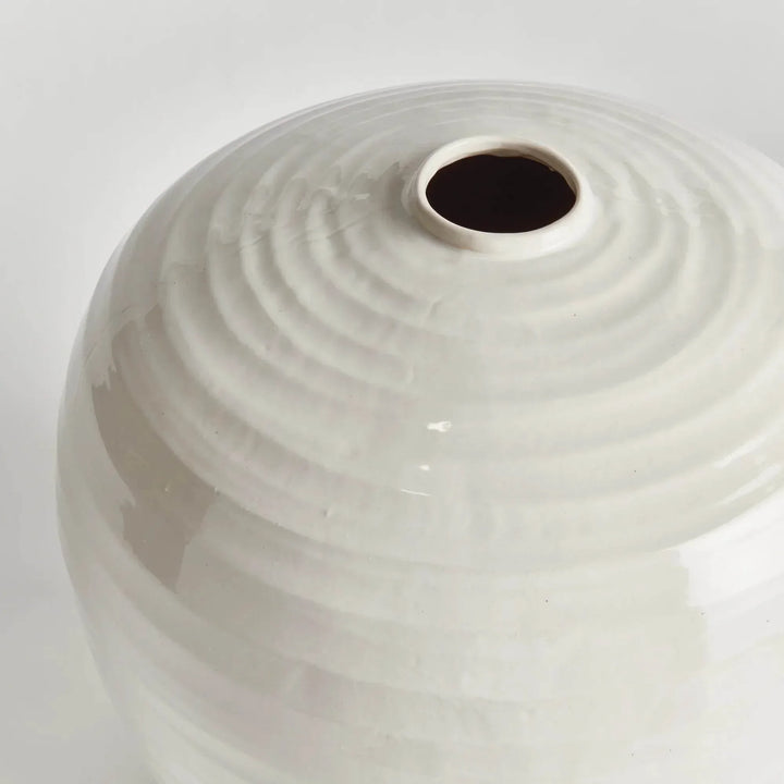 Close view of the large oatmeal stoneware vase mouth and ridged shoulder, with soft light across the glaze | Modern Organic