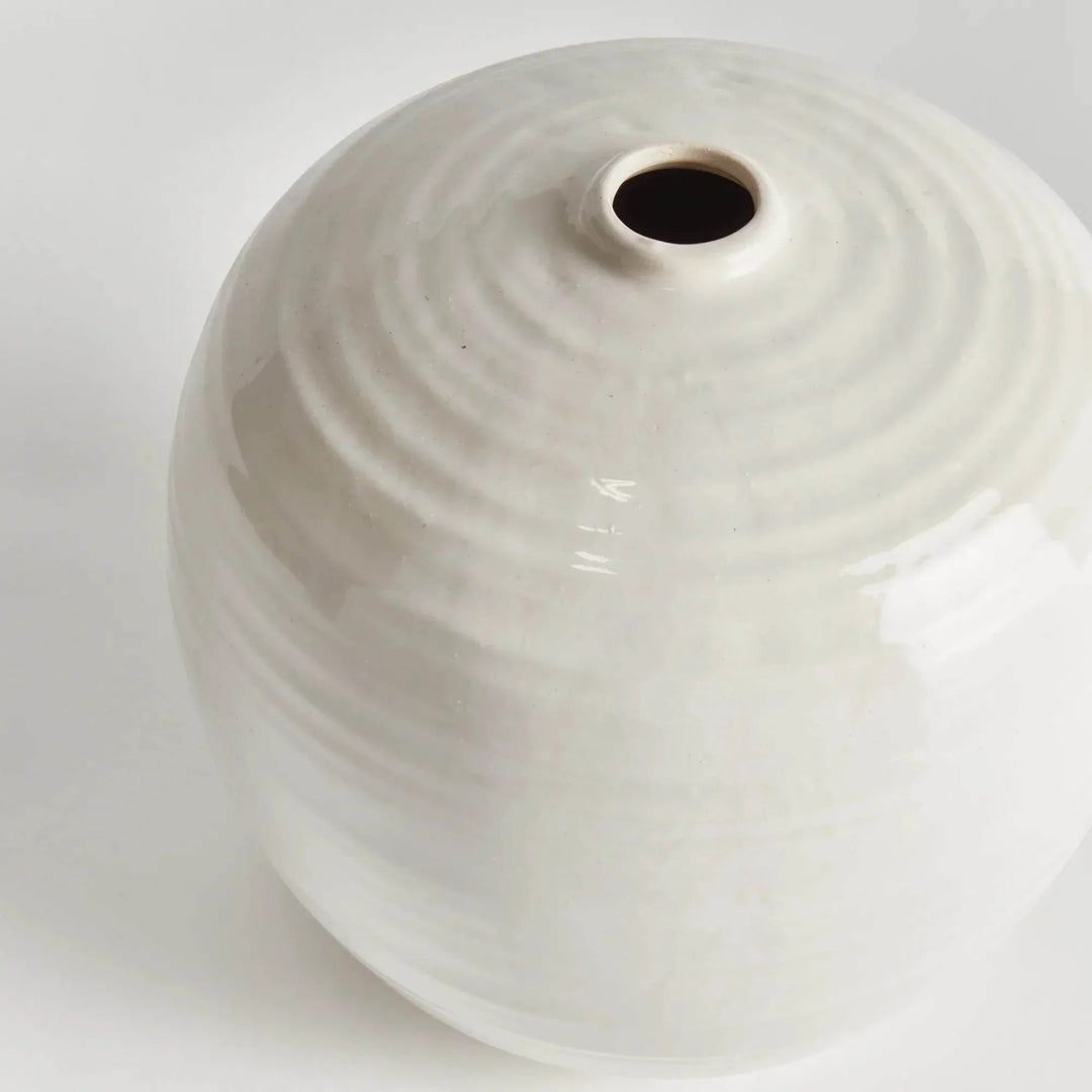 Close view of the small oatmeal stoneware vase opening, showing concentric ridges and pale reactive glaze | Modern Organic