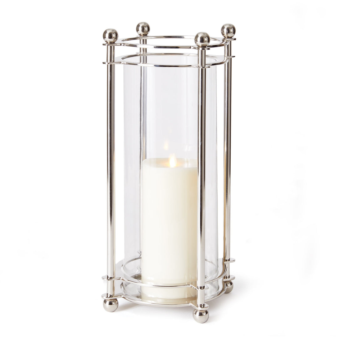 Extra tall chrome hurricane candle holder with glass cylinder and LED pillar candle styled in clean white backdrop
