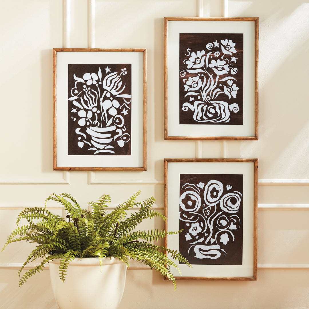 Made of whimsical cut out designs from the original artwork of Susan Nastasic, this playful set of three floral motifs are finished off with a printed mat and bamboo frames. In a warm neutral palette, a great set for den, family room or kitchen.