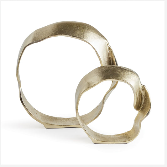 A textured champagne gold finish and sculptural shapes make this pair of cast aluminum sculptures unique. A contemporary touch for home office or den, in a book shelf, or styled in a tray on an ottoman.