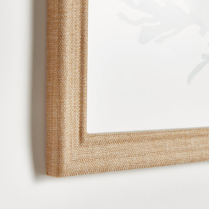 Close-up of the fabric-wrapped square frame surrounding a soft green coral silhouette print with textured woven finish – Coastal