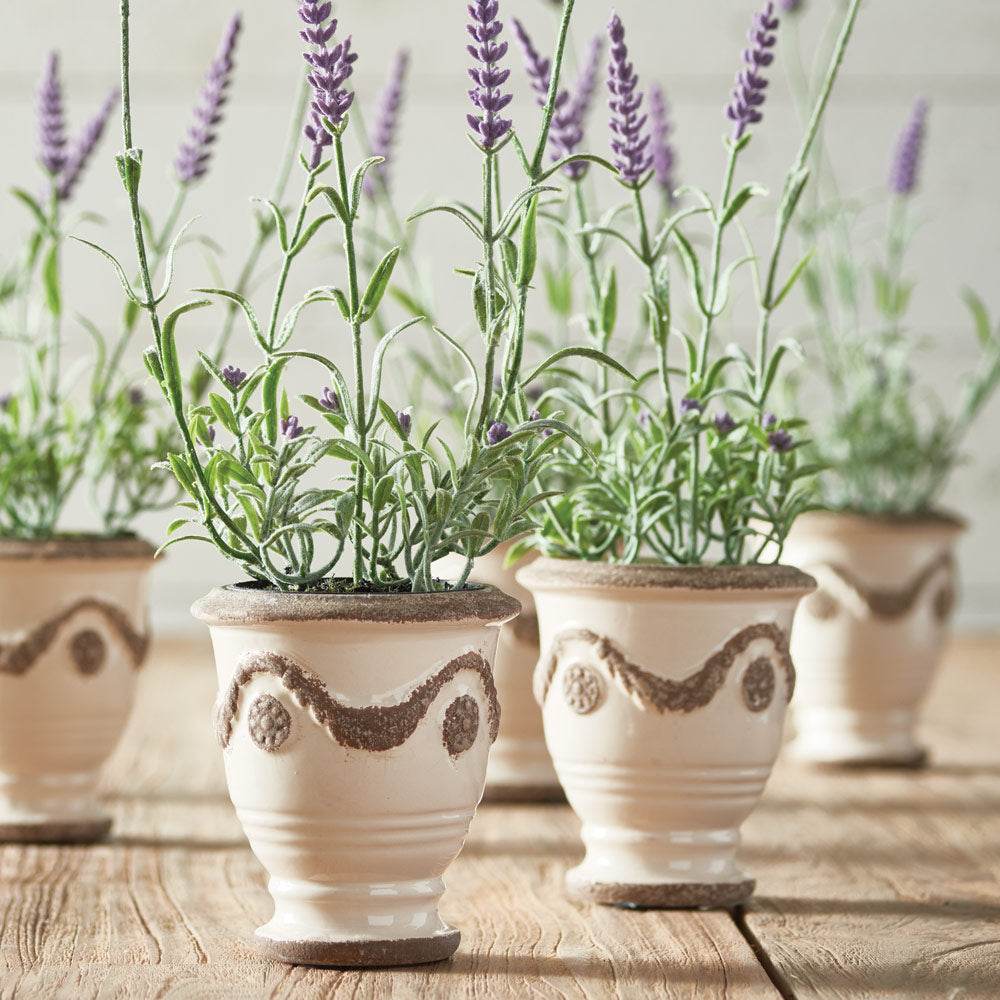Close-up of lifelike faux lavender stems and blooms with realistic foliage and soft purple color – French Country.

