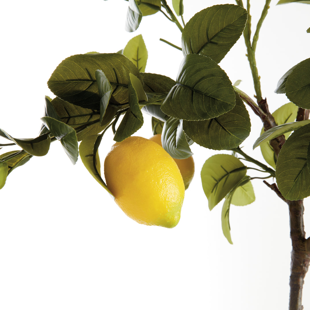Close-up of faux lemon tree branches with realistic yellow lemons and layered green leaves for botanical styling – European Cottage style.