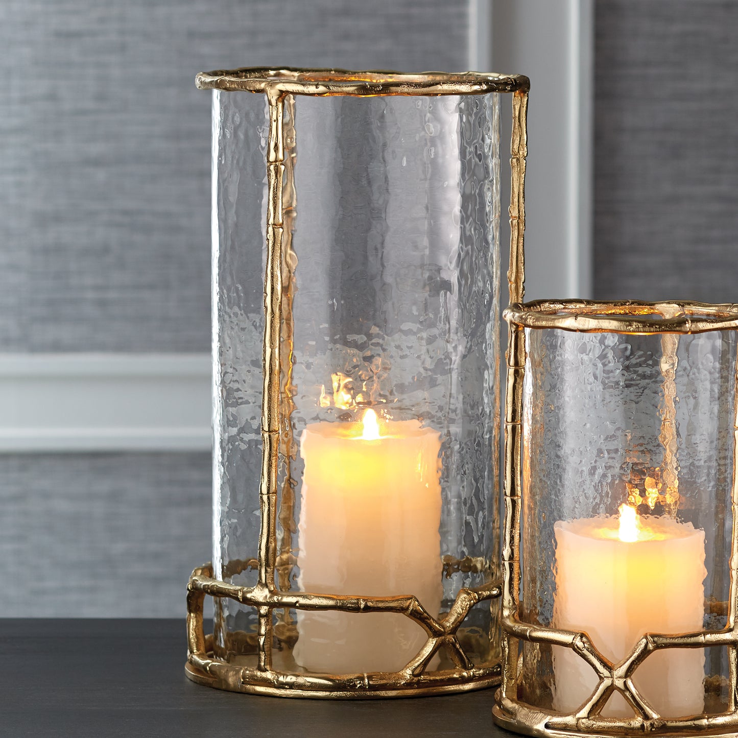 Add sophistication and refinement to your space with the Gold Hurricane Candle Holder 16". This elegant piece features a timeless structure and seeded glass insert, making it the perfect addition to any room. For added versatility, it is also available in a 10.5" size option.