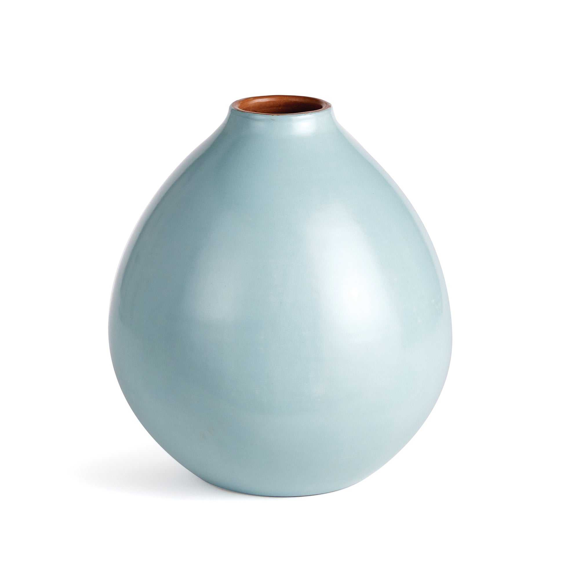 Made in Chulucanas Peru, this handcrafted vase is the product of warm climate, Peruvian clay and an artisan’s touch. Unlike traditional glaze firing, a method of pigmented clay and a stone buffing technique is used to achieve the rich color and smooth texture.