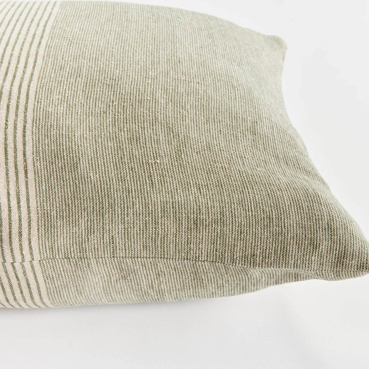 Corner detail of 24-inch flax linen pinstripe pillow in green and tan, woven texture and pinstripe pattern – Modern Farmhouse.