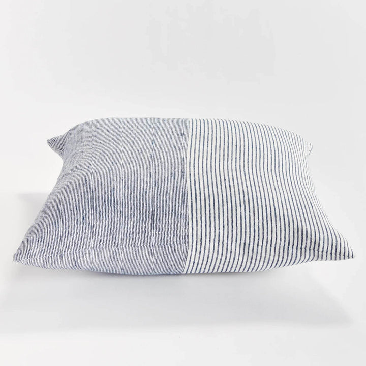 Side profile of 24-inch flax linen pinstripe pillow in navy and ivory, showing woven texture and removable cover – Nautical.