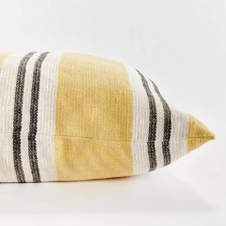Corner detail of 24-inch flax linen striped pillow in ochre and charcoal, showing seam and texture – Modern Boho.