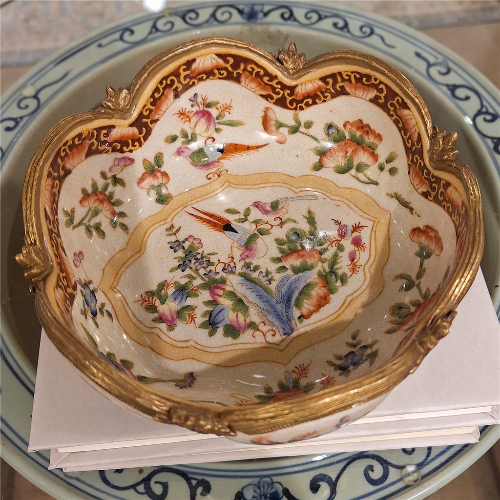 Overhead view of floral porcelain decorative bowl with scalloped form and multicolor botanical decoration – Traditional style