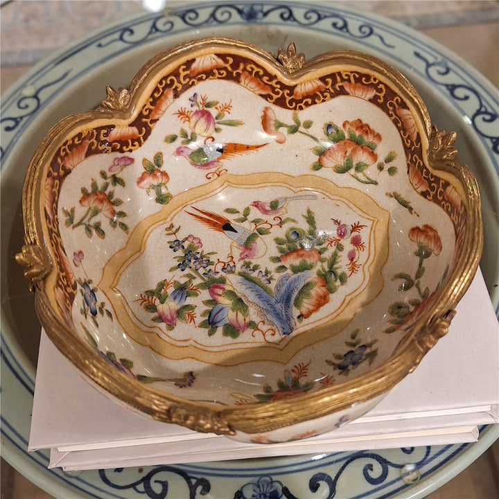 Overhead view of floral porcelain decorative bowl with scalloped form and multicolor botanical decoration – Traditional style