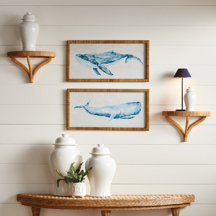 Framed whale wall art prints styled above rattan console with white ceramics and shiplap wall backdrop, creating a layered coastal entryway – Coastal style.