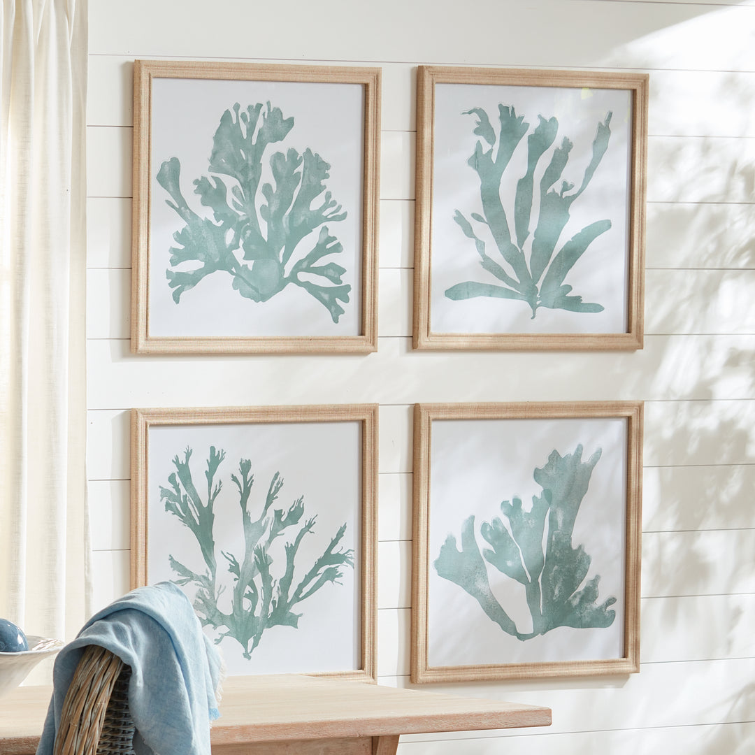 Framed soft green coral silhouette wall art arranged as a gallery display above a console with layered natural décor – Coastal