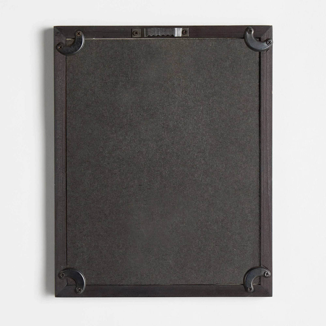 Back of black-framed pear print showing hardware and corner reinforcement for hanging – Vintage Botanical.