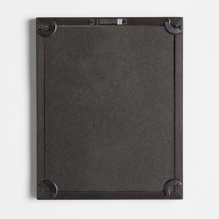 Back of black-framed pear print showing hardware and corner reinforcement for hanging – Vintage Botanical.