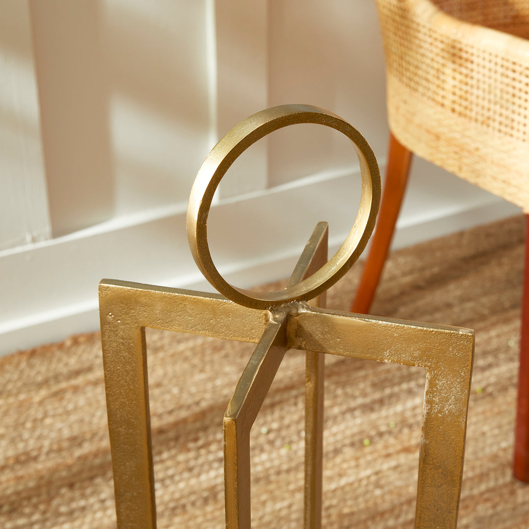 Close view of antique gold geometric metal lantern circular handle and upper frame detail, sculptural lantern Transitional style
