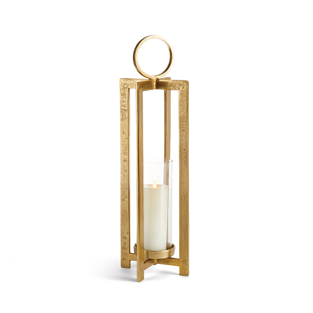 Small antique gold geometric metal lantern with clear glass hurricane insert and ring handle on white background, decorative candle lantern Transitional style
