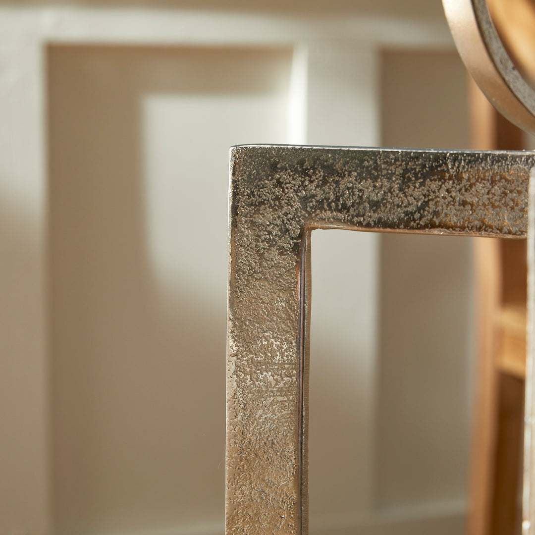 Close view of antique silver geometric metal lantern textured frame corner and artisan metal finish, Transitional style