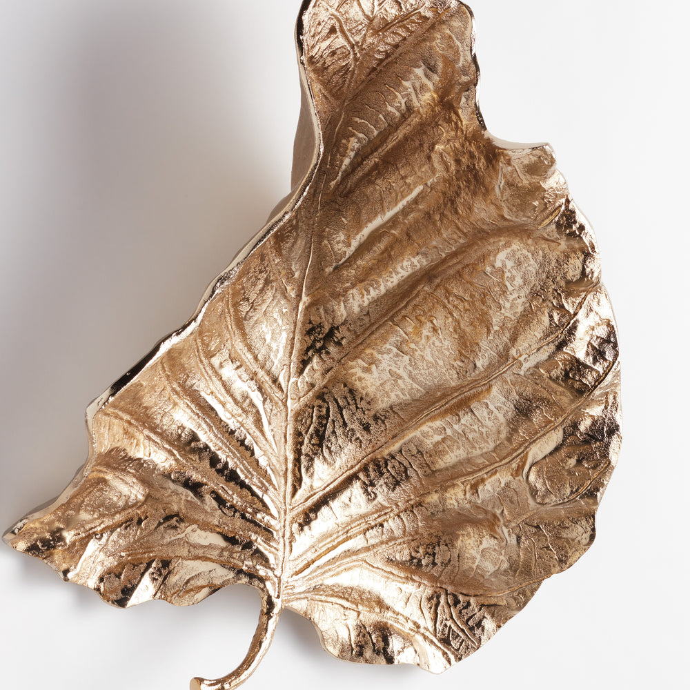 Angled profile of cast aluminum leaf sculpture, revealing dimensional depth, curvature, and shadow play