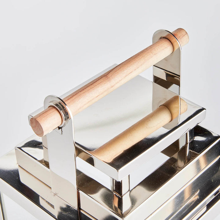 Close-up detail of glass panel and clean silver frame of small lantern