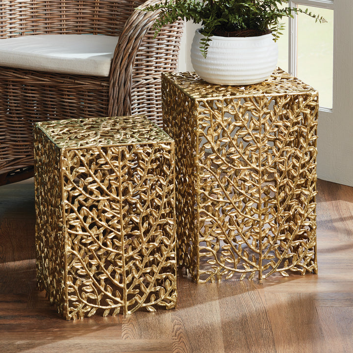 Gold vine accent tables styled in modern sunroom with woven chair and white planter