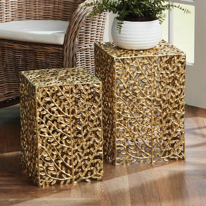 Gold vine accent tables styled in modern sunroom with woven chair and white planter