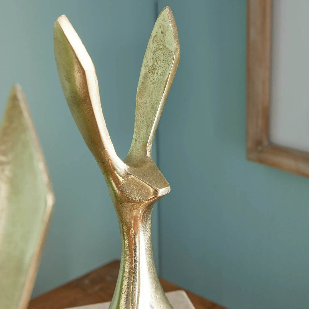 Detailed view of jackrabbit sculpture ear with gold texture and angled geometric design – Modern Coastal.