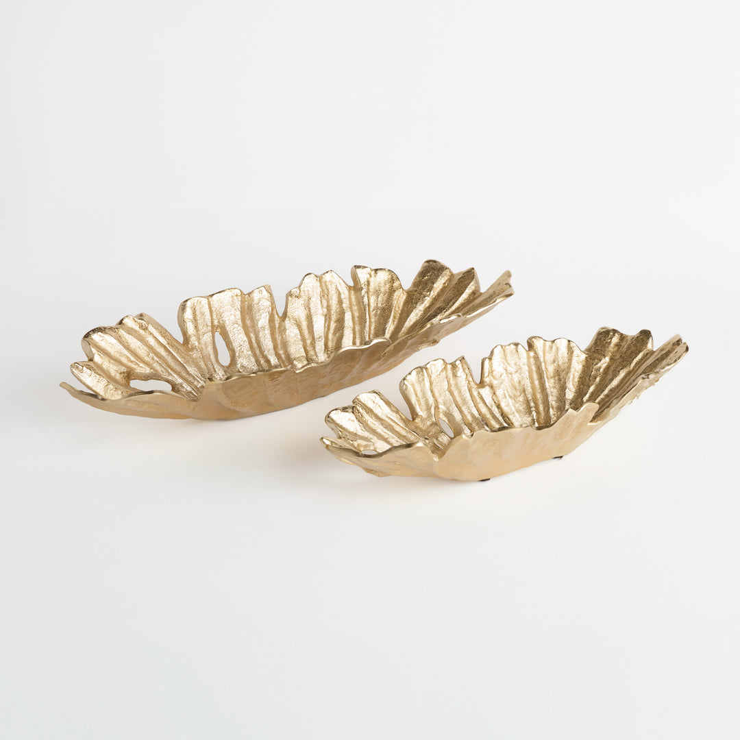 Set of two gold cast aluminum decorative oval bowls with organic ridged edges, displayed side by side on white surface – Transitional style.