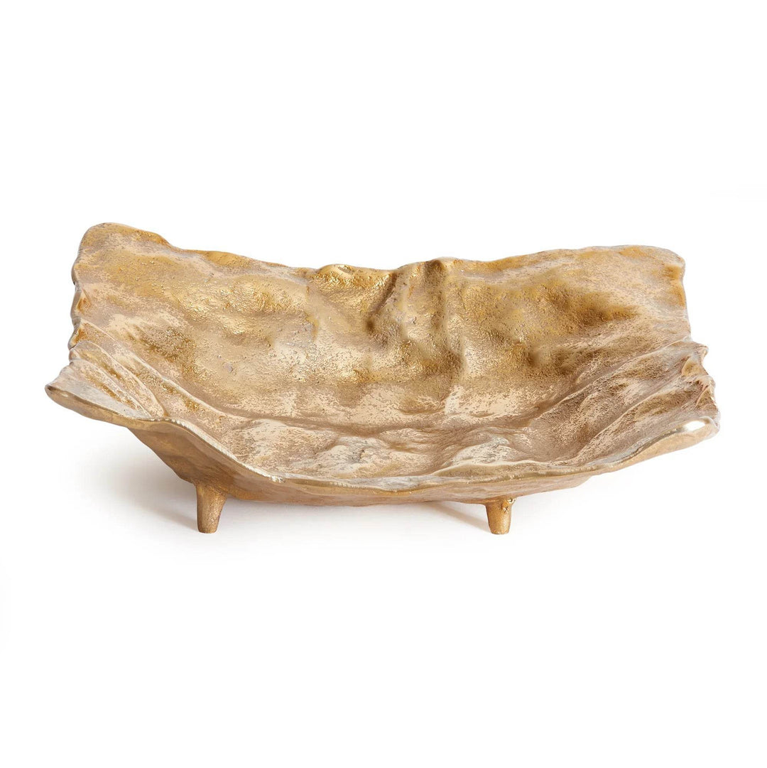 Large gold cast aluminum decorative tray with organic sculptural form and raised feet, shown on white background for tabletop decor