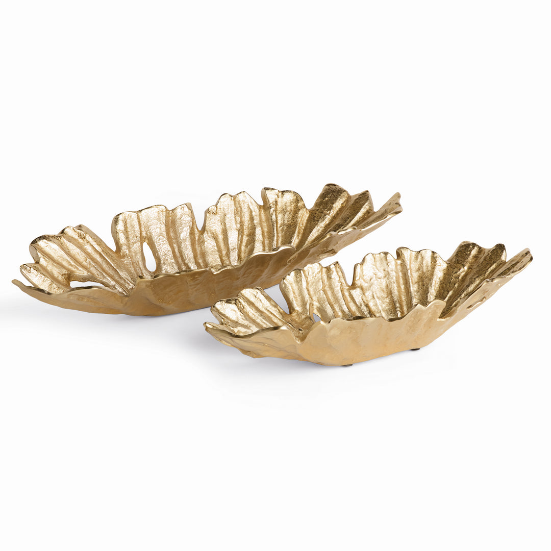 Gold decorative cast aluminum oval bowls in set of two, shown from angled side view with sculptural texture and asymmetrical form – Contemporary style.